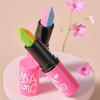 Pink lipstick with colorful applicator on a beige background with flowers